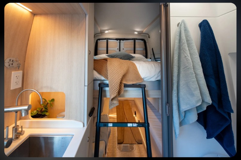  and scenic window views.|Modern RV rental interior with kitchen (sink — photo 4
