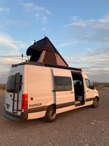 White camper van with an open side