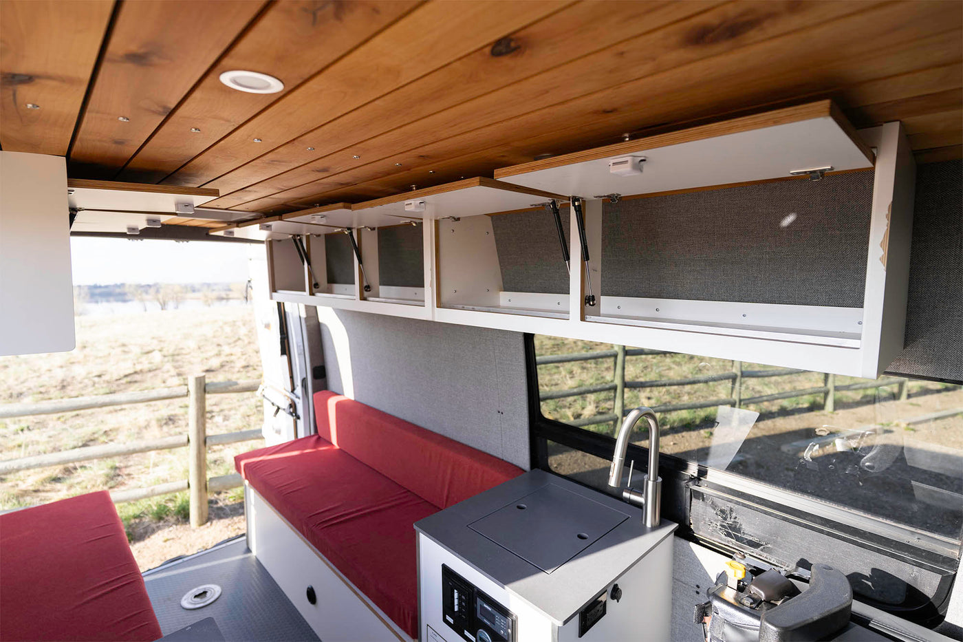  and convenient overhead storage.|Step into this RV rental! Two red benches — photo 13