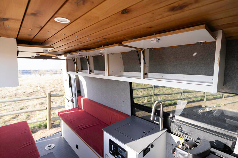  and convenient overhead storage.|Step into this RV rental! Two red benches — photo 13