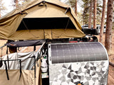 Rooftop tent, solar panel, & amenities for your rv rental camping adventure in the pine forest.