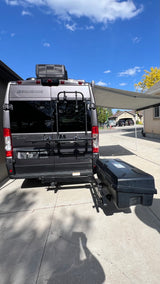 This gray Sequence RV rental is fully equipped with a bike rack, rear storage, and an awning, ready for your next trip.