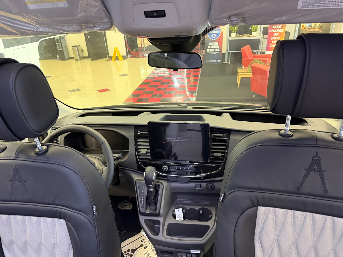  offers adventure for your next trip.|Comfortable two-person quilted seat with seatbelts and power outlets in an RV rental interior — photo 3