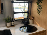  ready for a peaceful camping adventure.|This classic silver Airstream RV rental is nestled among trees