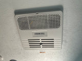 RV rental overhead: EVERCHILL air conditioner vent on ceiling, with a visible warning label.