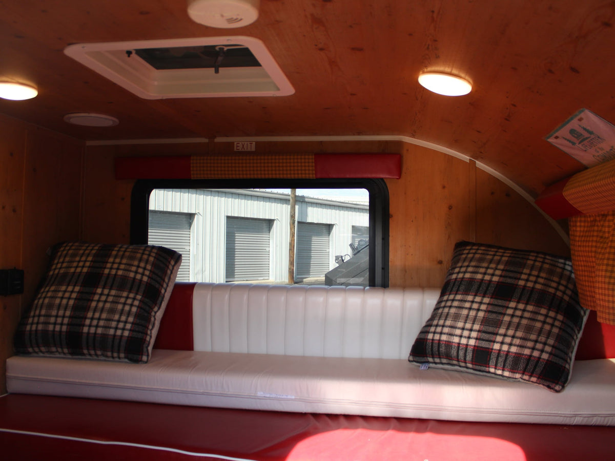  is perfect for an RV rental adventure and outdoor travel.|Cozy RV rental interior with warm wood paneling — photo 3