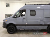 Side view of a gray Mercedes-Benz Sprinter camper van with off-road tires, roof rack. Perfect for an rv rental.
