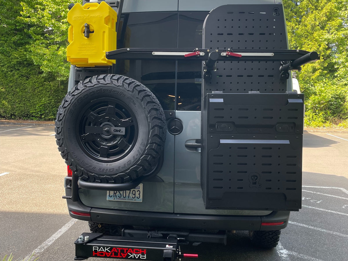  showcasing its off-road capability.|Front view of a rugged Mercedes Sprinter adventure van with off-road lights & custom bumper — photo 3