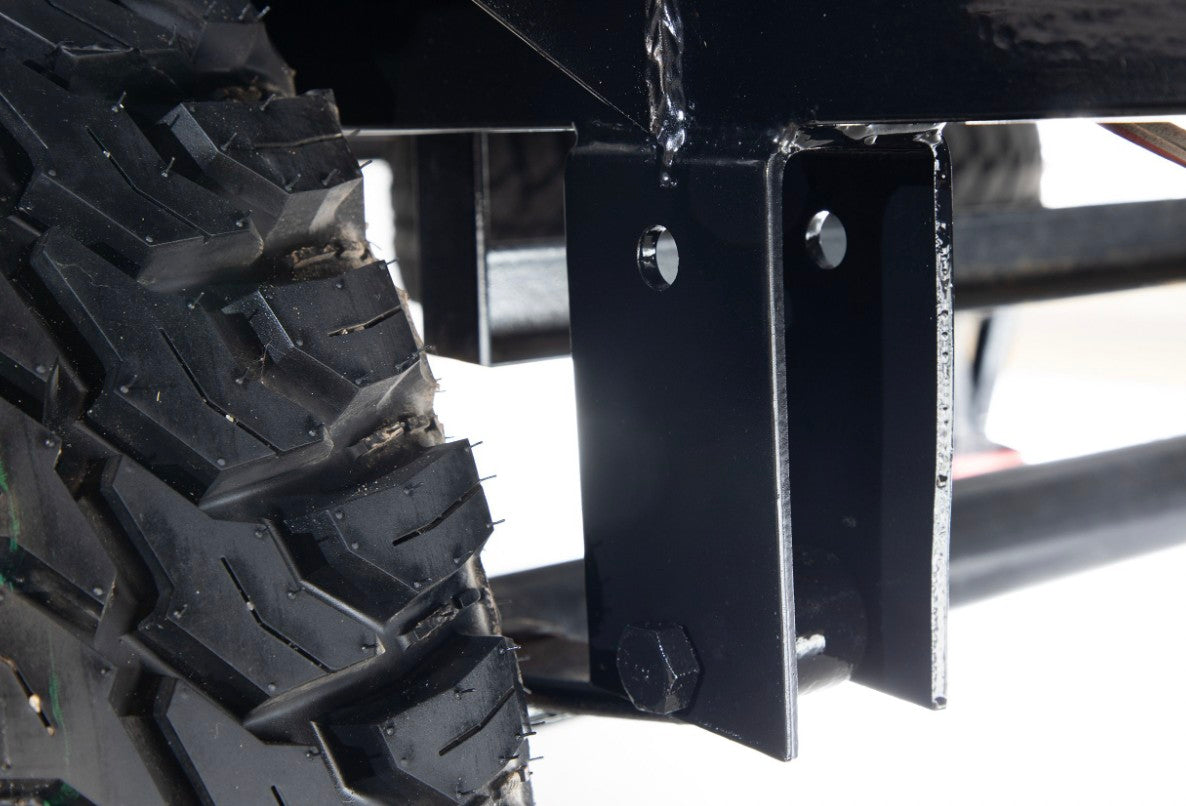 Close-up: rugged tire tread & sturdy black frame, vital for a robust RV rental trailer.