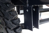 Close-up: rugged tire tread & sturdy black frame, vital for a robust RV rental trailer.