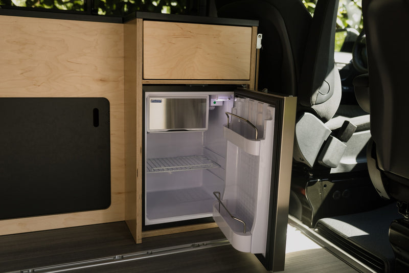  offering practical travel.|This rv rental features a compact kitchen with a sink — photo 7