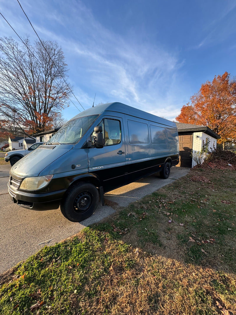 This blue & black Mercedes Sprinter van — photo 1