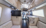 Step inside this bright rv rental! Modern interior with a kitchen, seating, & wall-mounted TV.