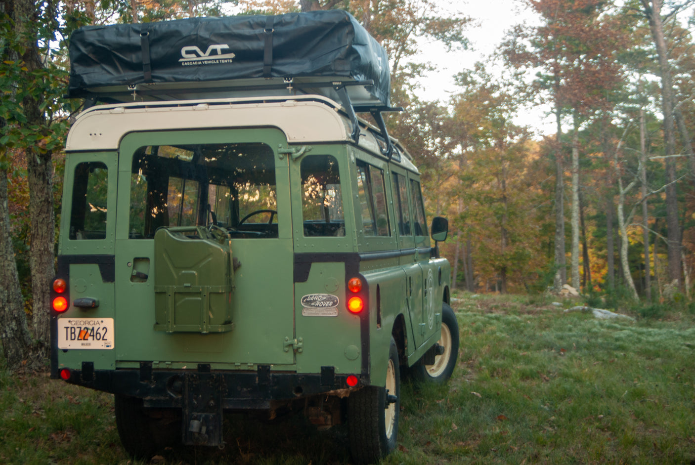 This classic green Land Rover with a CVT rooftop tent is ready for an RV rental outdoor adventure.