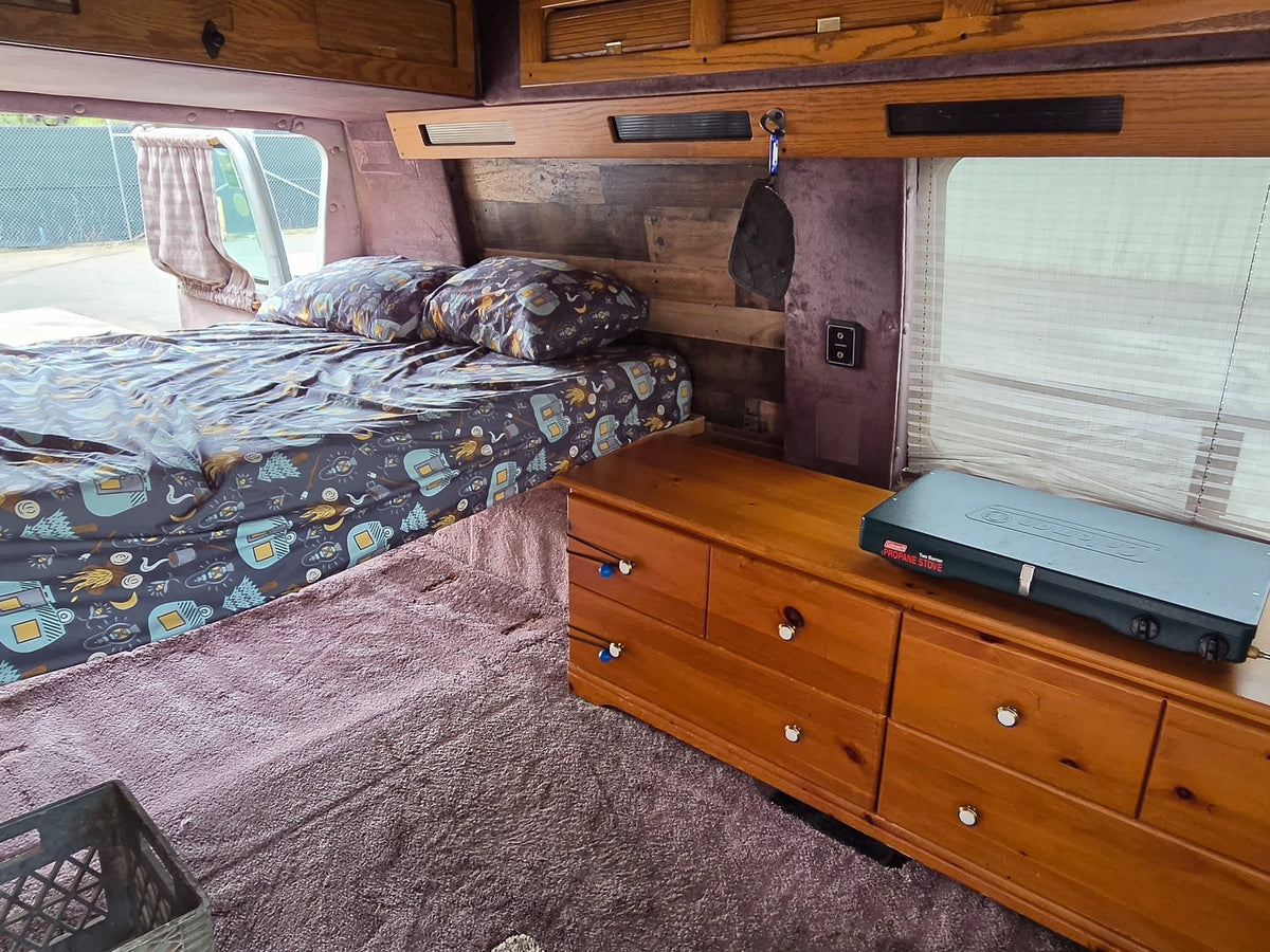  ready for road trips.|Explore this cozy RV rental interior: a bed — photo 12