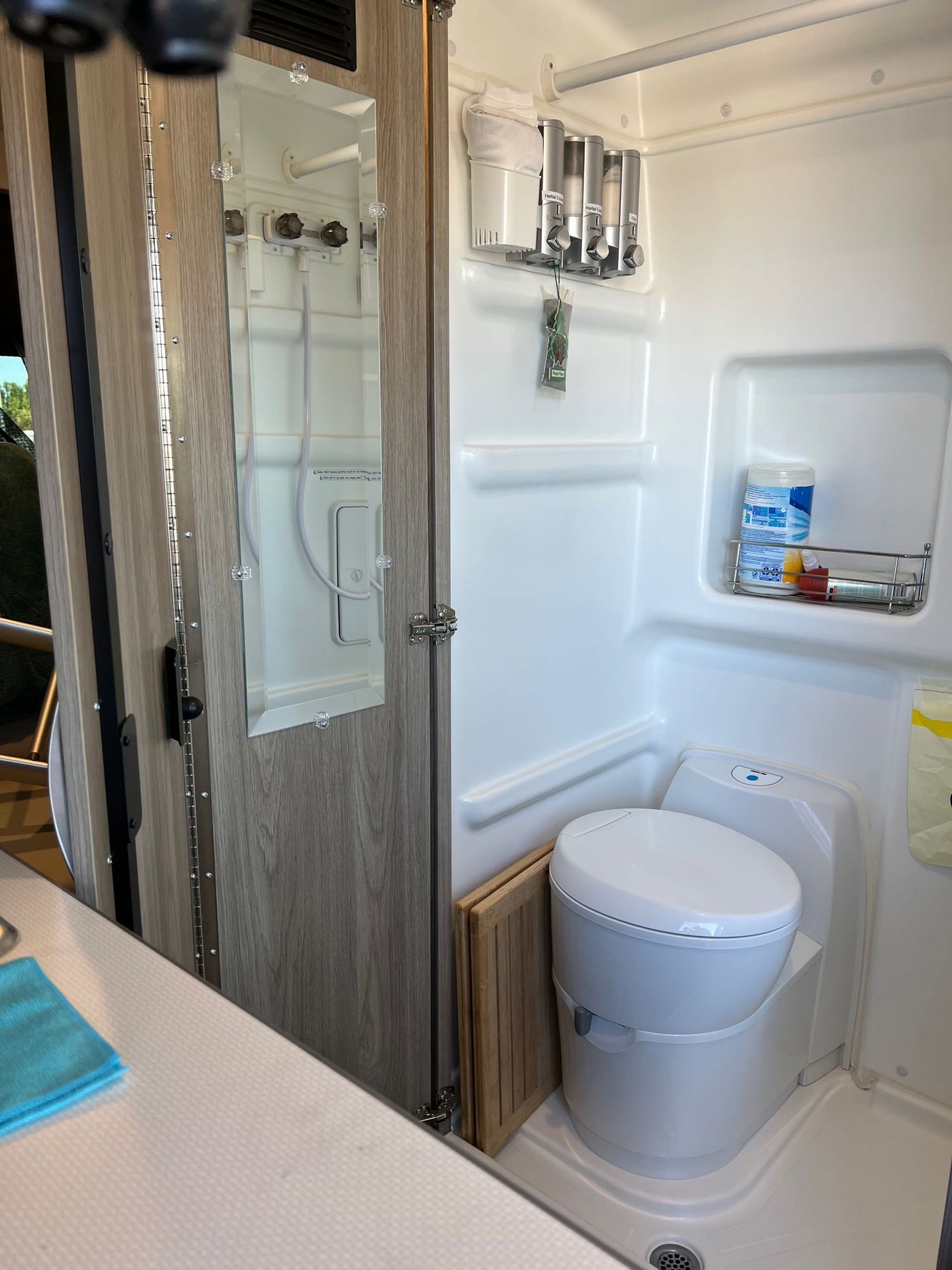  back doors open revealing interior and ocean view. Enjoy scenic travels!|Family-friendly RV rental interior with kitchenette — photo 9