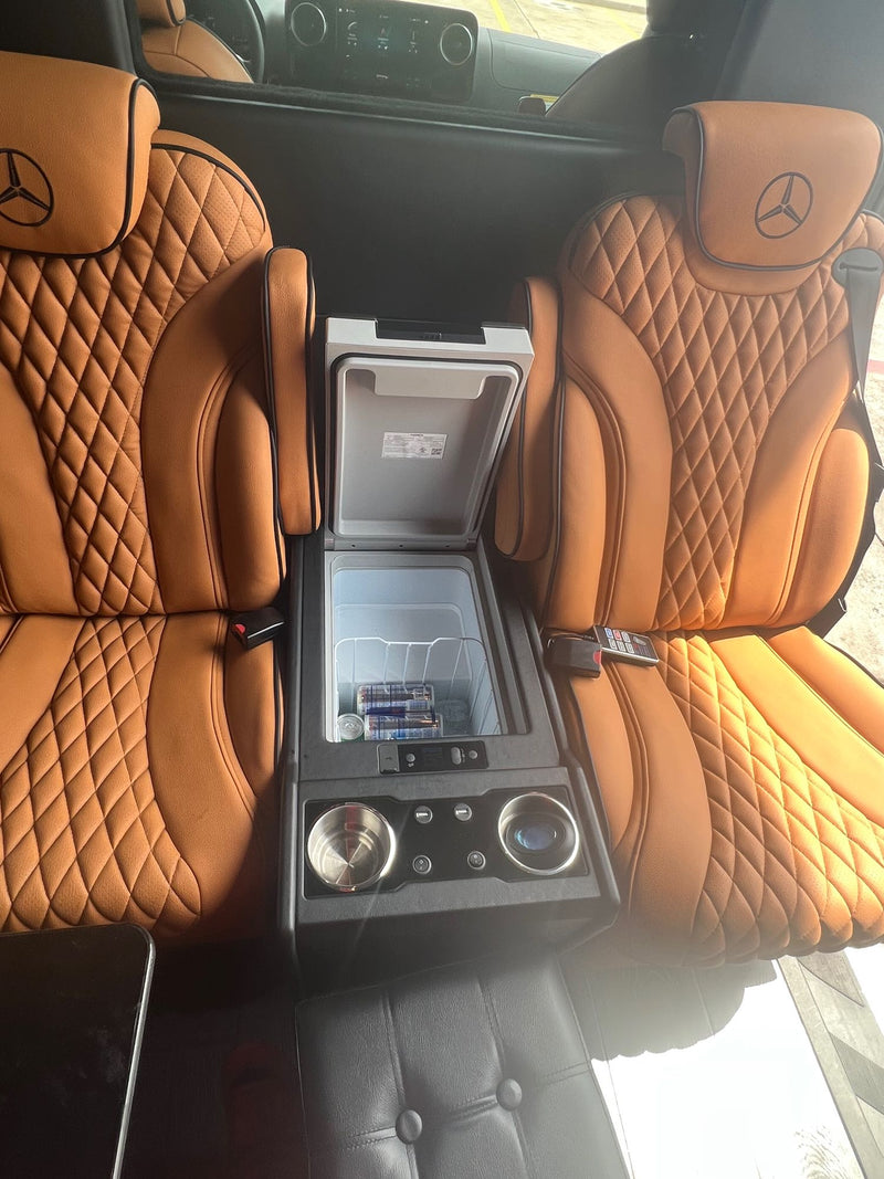  diamond-stitched passenger seat for comfort.|Detailed view of an rv rental van's interior. Highlights tan seats with Mercedes-Benz logo — photo 9