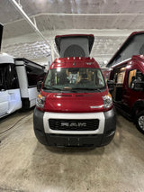 Red Winnebago Ram ProMaster pop-top camper van, ideal for your next RV rental adventure.