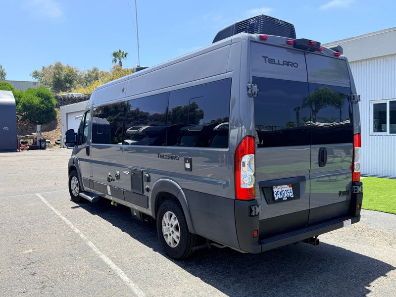Gray Tellaro RV rental van parked outdoors on asphalt — photo 1