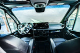 RV rental van interior with frosted windshield, dashboard, and front seats, hinting at a cold journey.