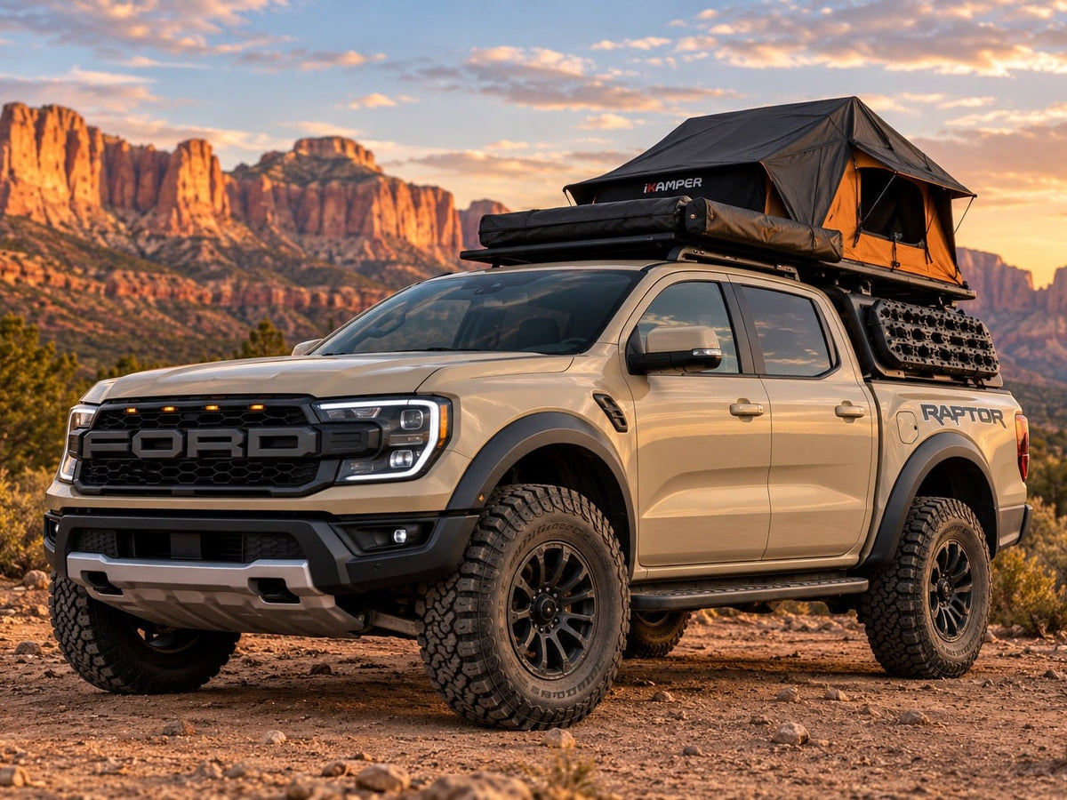 Explore off-road in a tan Ford Ranger Raptor with a rooftop tent! Great car rental for desert adventure & camping among red rocks.|A beige Ford Ranger Raptor pickup with a rooftop tent — photo 1