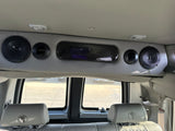 Spacious RV rental interior: featuring premium JBL speakers, comfort seating with globe headrests, and cabin amenities.