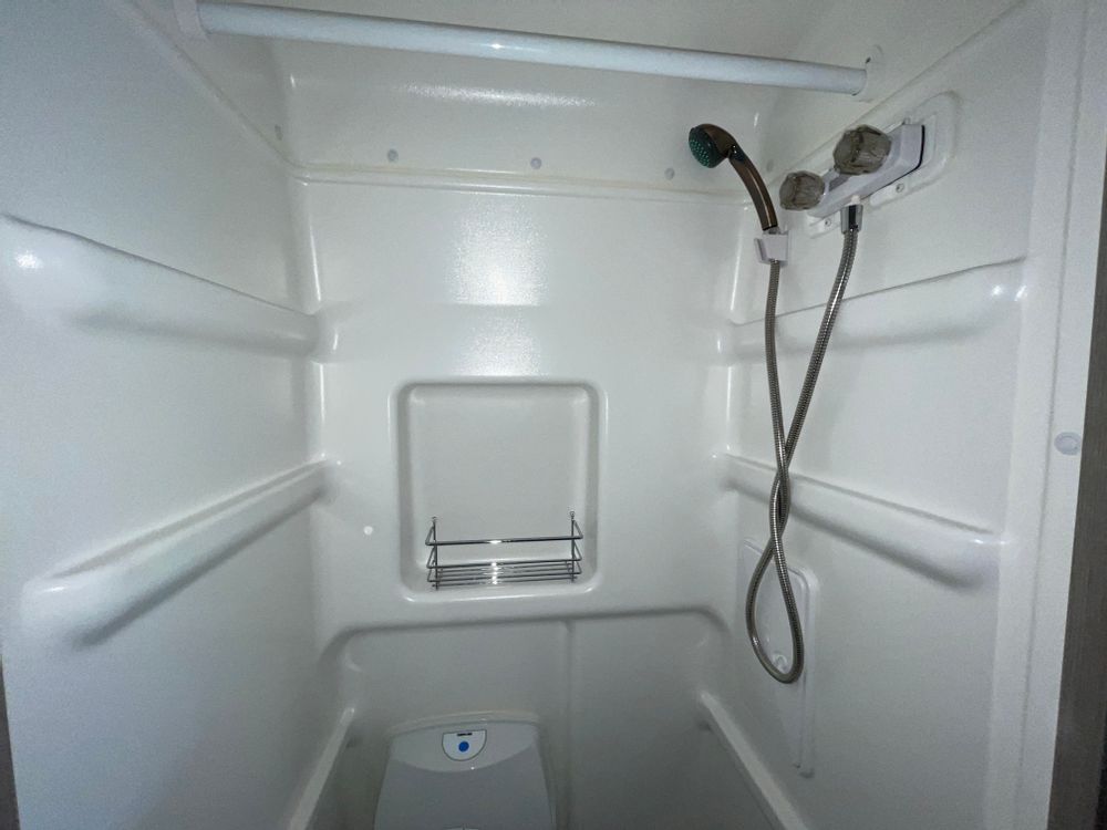 looking towards the driver's area.|RV rental camper van's bright interior. Compact kitchen with stainless sink — photo 6
