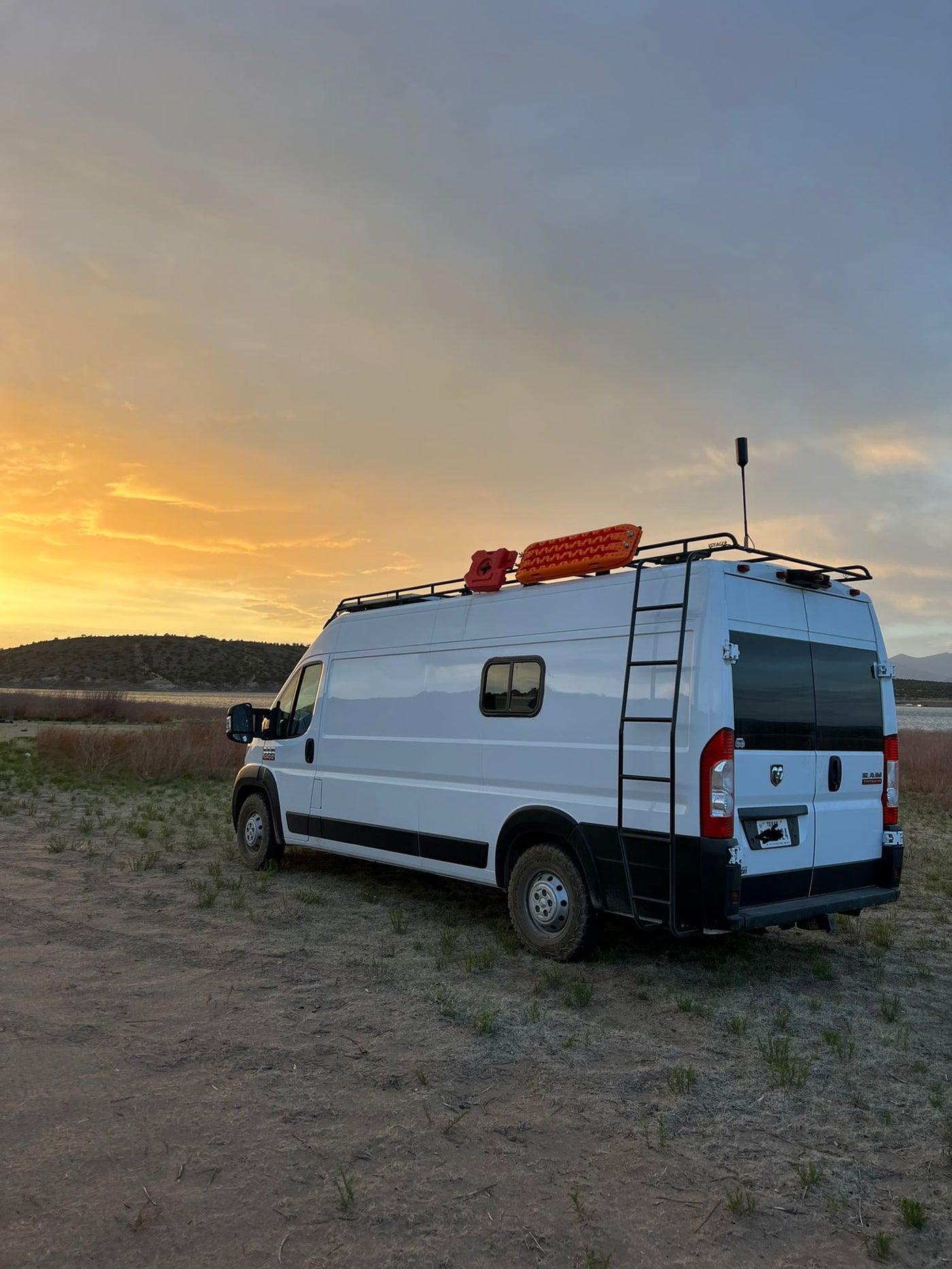  surrounded by trees. Ideal RV rental.|Snow-covered white RV rental van — photo 5