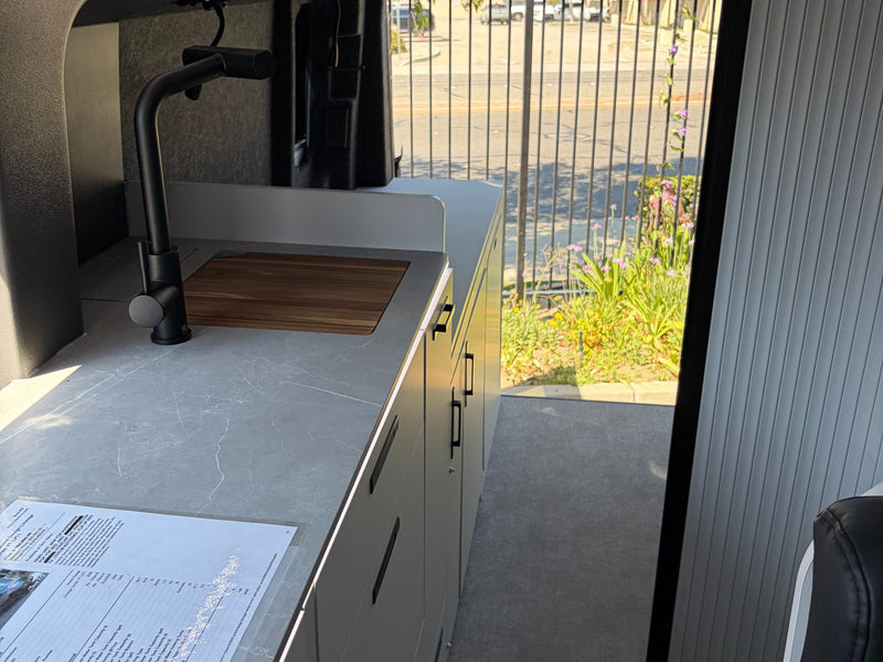  showing its unique off-road features.|Modern rv rental interior with slatted bed and partition — photo 10