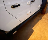 Close-up side view of a white Jeep with black Power Step XL side steps. Perfect companion for your RV rental adventures.