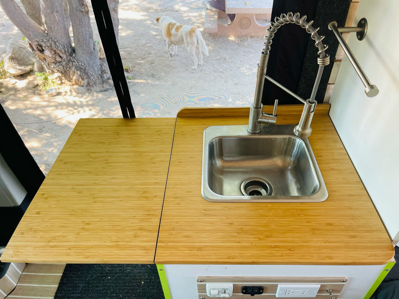  with a clear view of a beautiful outdoor garden.|Black RV rental parked near majestic Yosemite Falls and granite mountains — photo 11