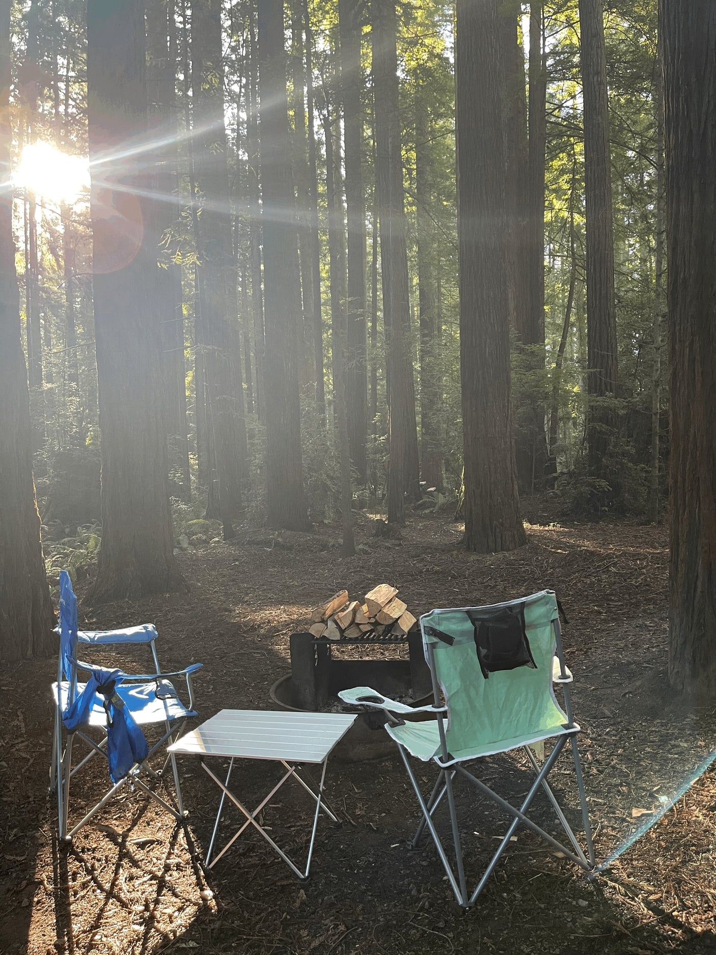  perfect for an outdoor adventure.|A couple stands with a silver Airstream rv rental & Jeep SUV on a mountain road