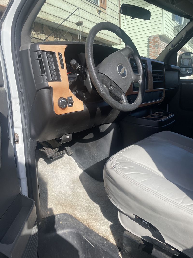  perfect for road trip convenience.|Open rear of a white camper van — photo 3