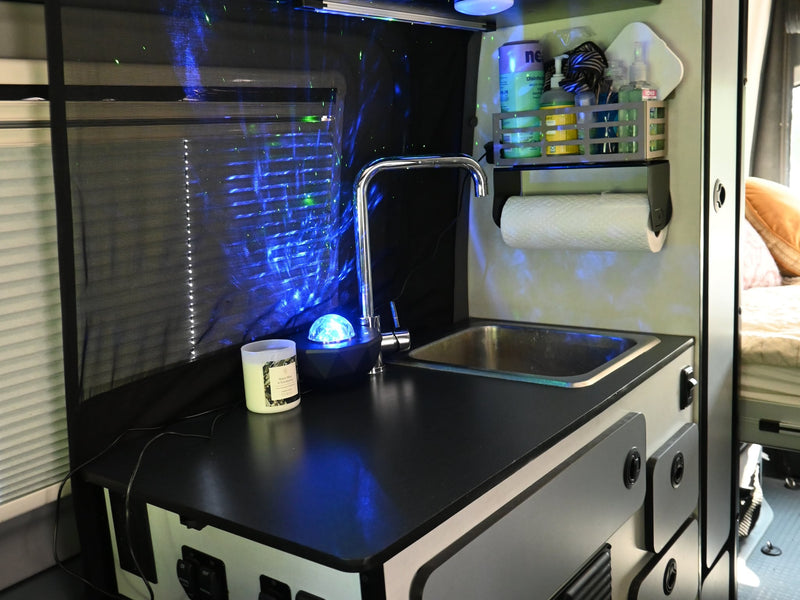  and a spare tire seen through the back window.|Spacious rv rental interior with swiveling front seats — photo 9