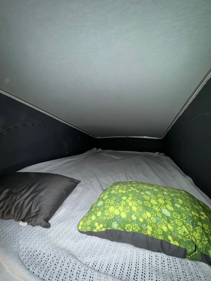  and various RV accessories ready for adventure.|Experience comfort in your rv rental: a cozy camper kitchen with a two-burner stove — photo 16