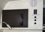 Essential RV rental control panel: Tank heater, water pump, awning lights switches, plus a flexible reading light.