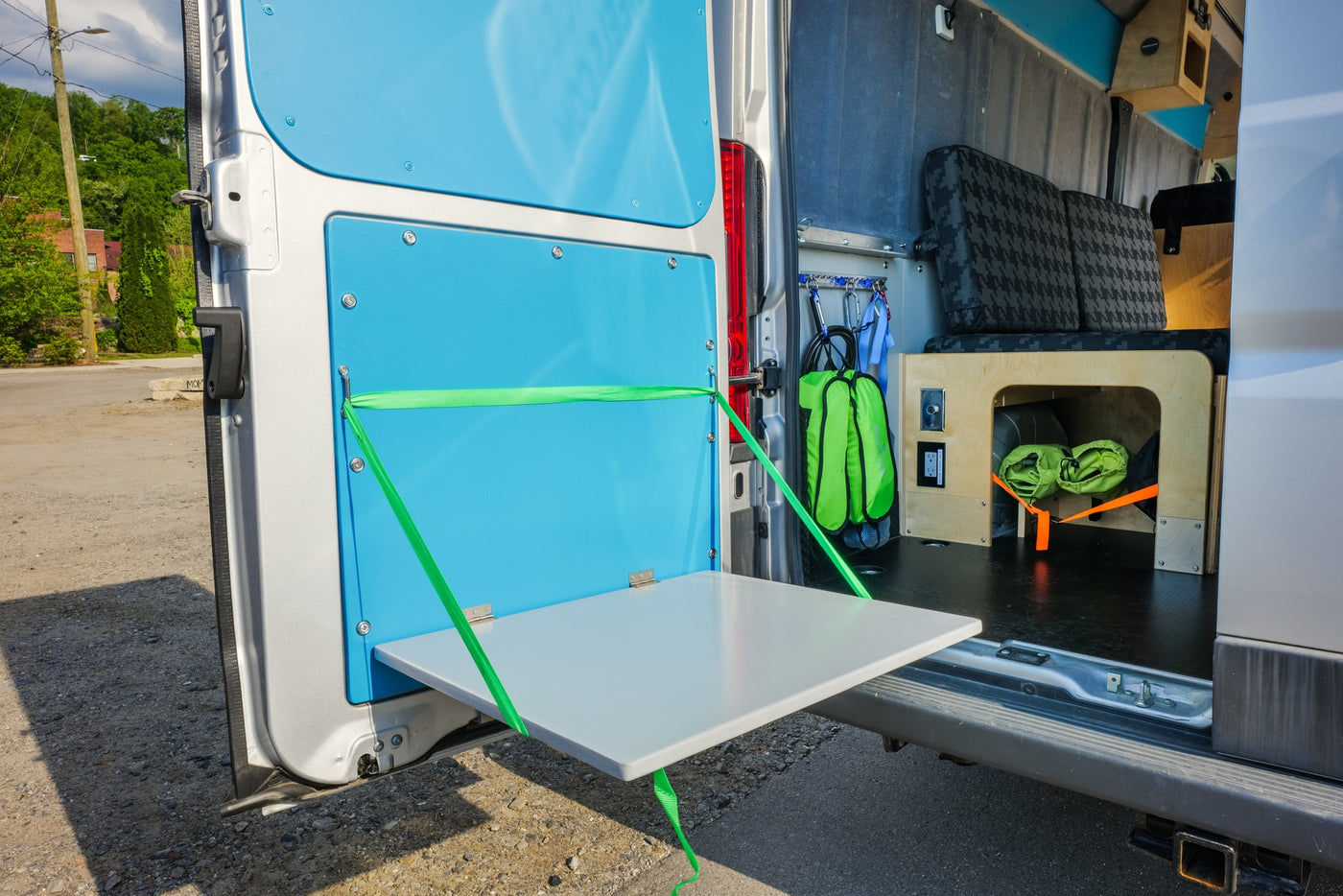  and a view of nature.|RV rental set up for camping in a sunny forest with mountains. A table — photo 9