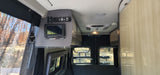 Clean rv rental interior featuring a control panel, AC unit, USB charging, and rear view windows.