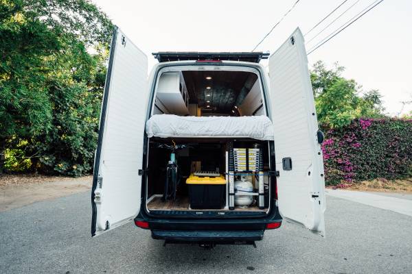  showing its custom interior with compact kitchen — photo 5