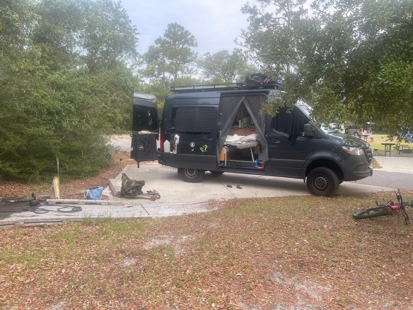  and ample storage for mobile living.|Bright RV rental interior with a cozy bed — photo 6