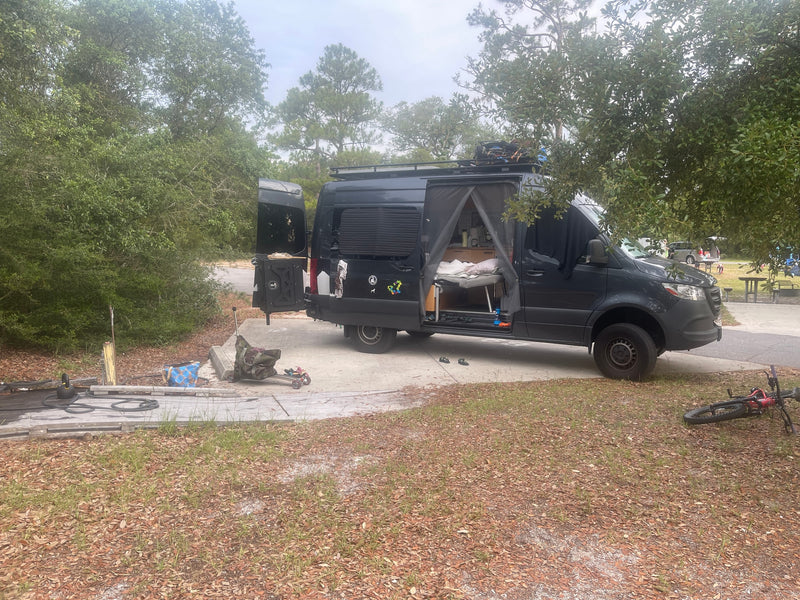  and ample storage for mobile living.|Bright RV rental interior with a cozy bed — photo 6