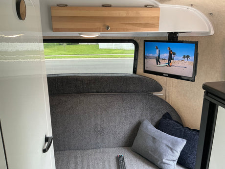  and iconic red stripe. Ideal for an RV rental.|White Scamp compact travel trailer