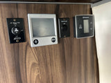 RV rental interior showing Alde and Dometic climate and lighting controls. Useful for visually impaired guests.