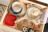 Efficient kitchen drawer organization in your RV rental. Features compact dishes, cookware, and storage essentials for travel.