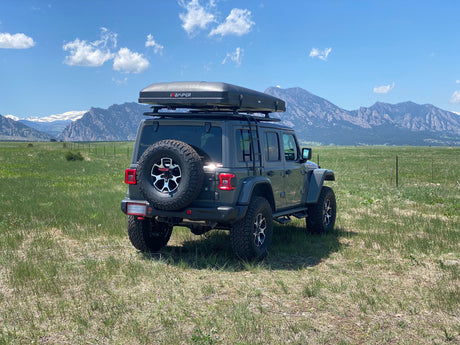 Adventure awaits! This Jeep Wrangler with iKAMPER rooftop tent is a unique rv rental for mountain camping.