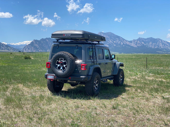 Adventure awaits! This Jeep Wrangler with iKAMPER rooftop tent is a unique rv rental for mountain camping.