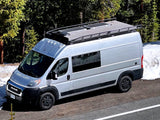 Adventure awaits in this silver Ram ProMaster camper van, ideal for RV rental and off-grid van life with solar power.
