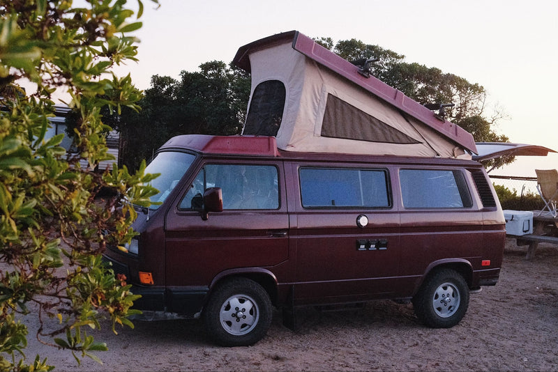 A maroon pop-top VW camper van — photo 1