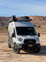 Overland Ford Transit camper van **rv rental** by Vandoit. Ready for adventure on a dirt road in a desert canyon.