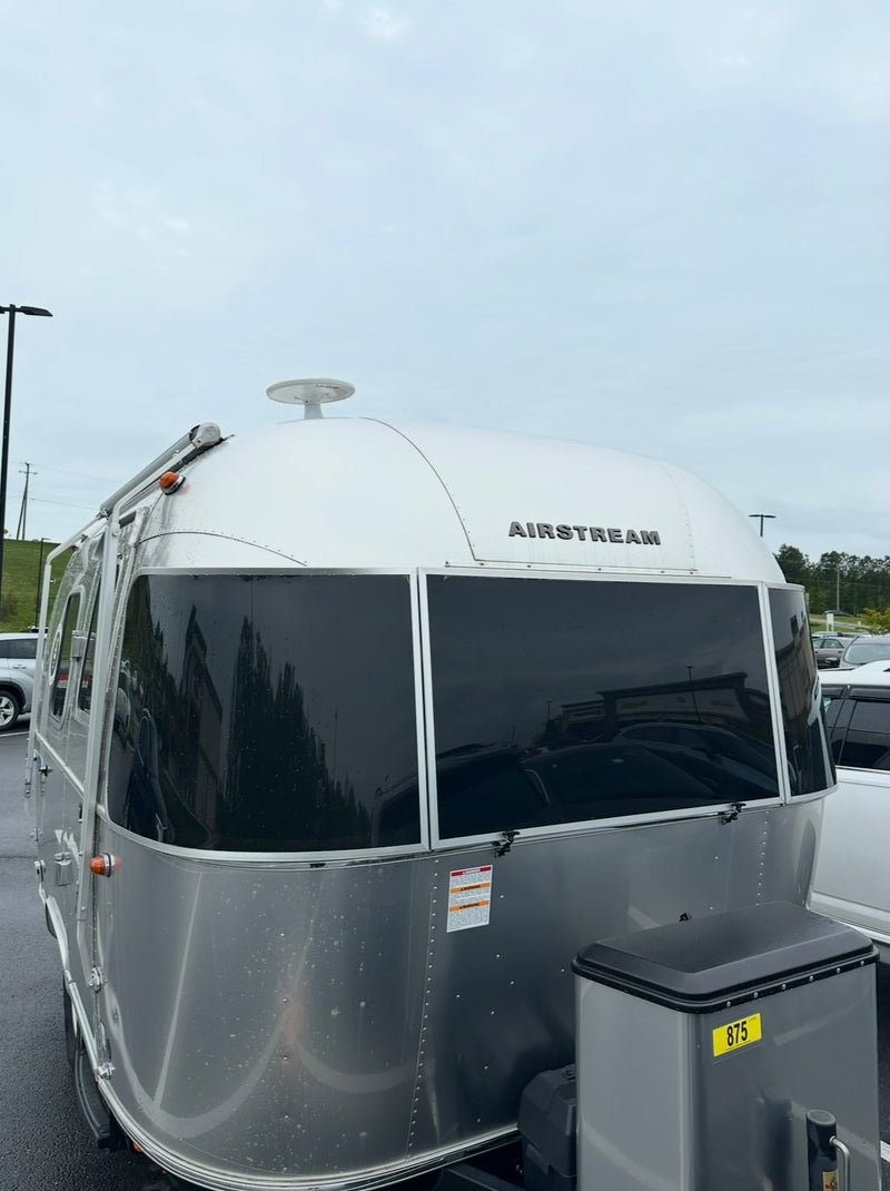  and privacy blinds.|Inside a spacious rv rental: modern travel trailer interior with shiny aluminum walls — photo 7